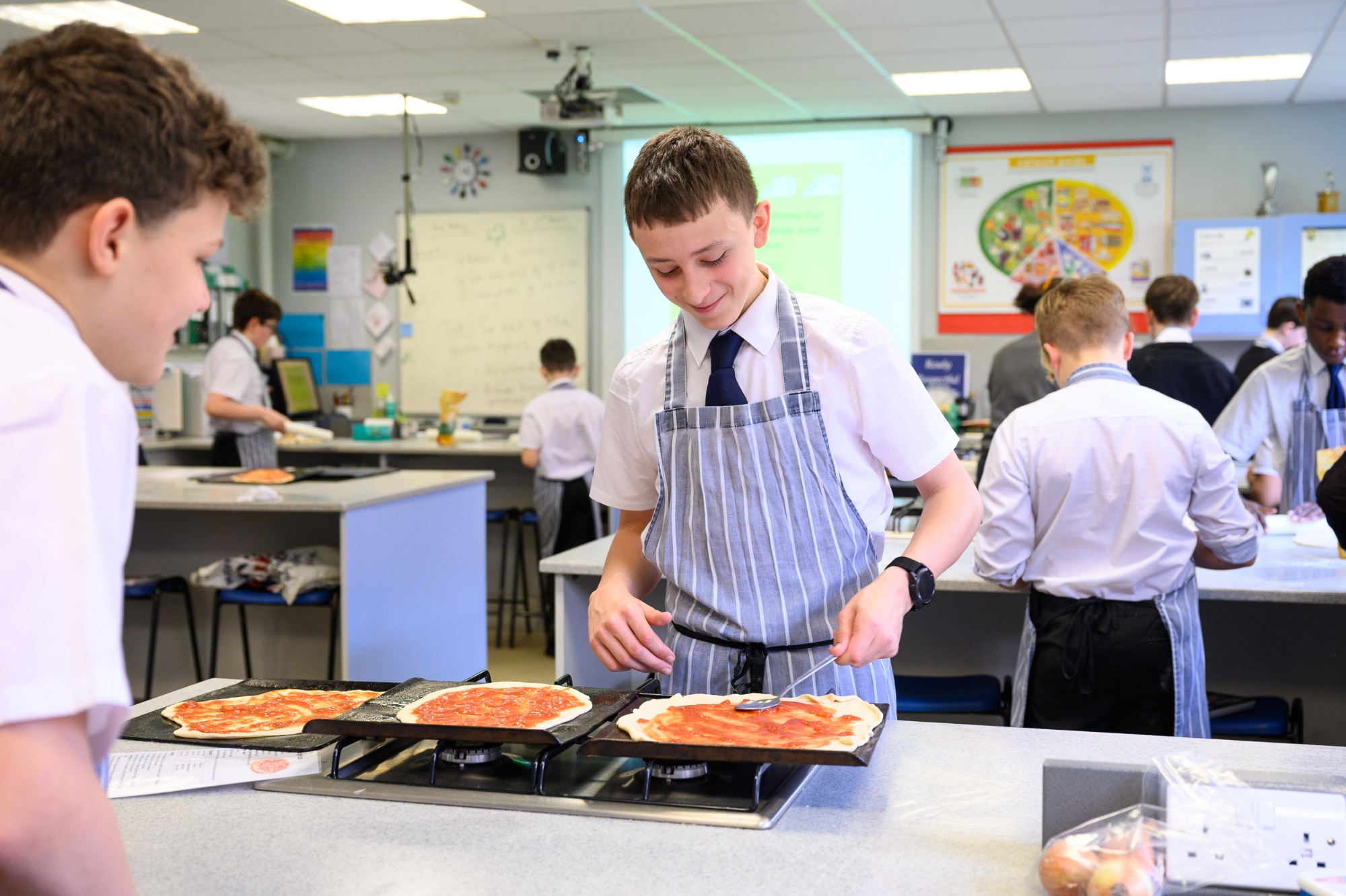 A photo of a student in the Food Room