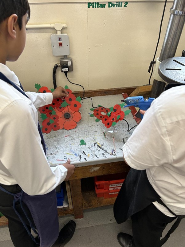 Photo of students making poppies